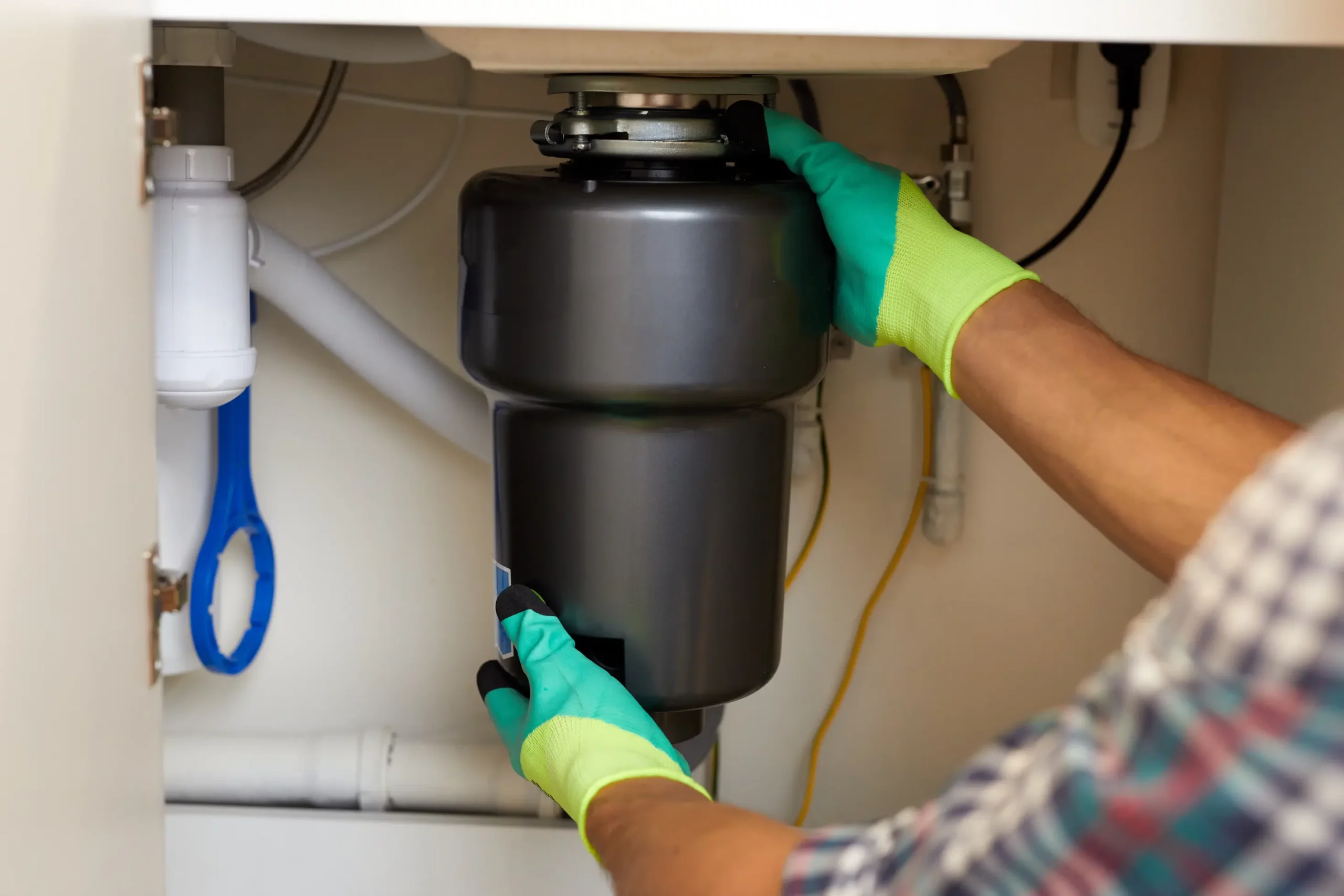 Garbage disposal unit installed under a kitchen sink