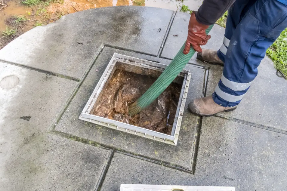 Sump pump installed in a home basement to help prevent water damage