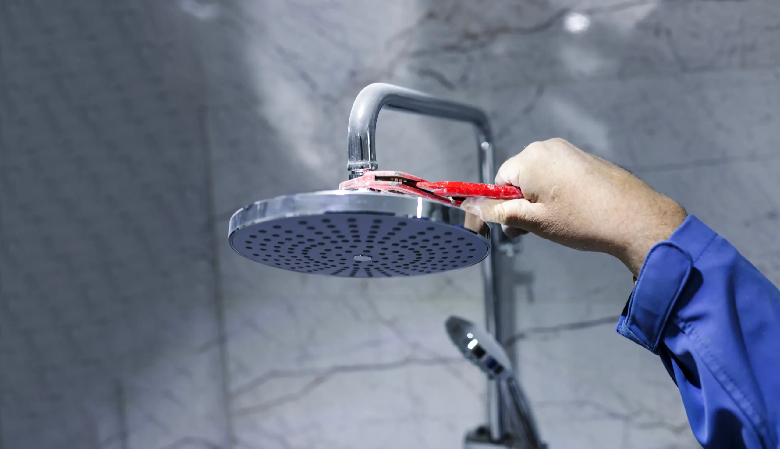 Modern shower head installed during a bathroom plumbing upgrade